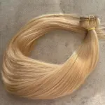 Sötétbézs 100% emberi hajból készült csatos haj kb. 110-115 gr 60 cm